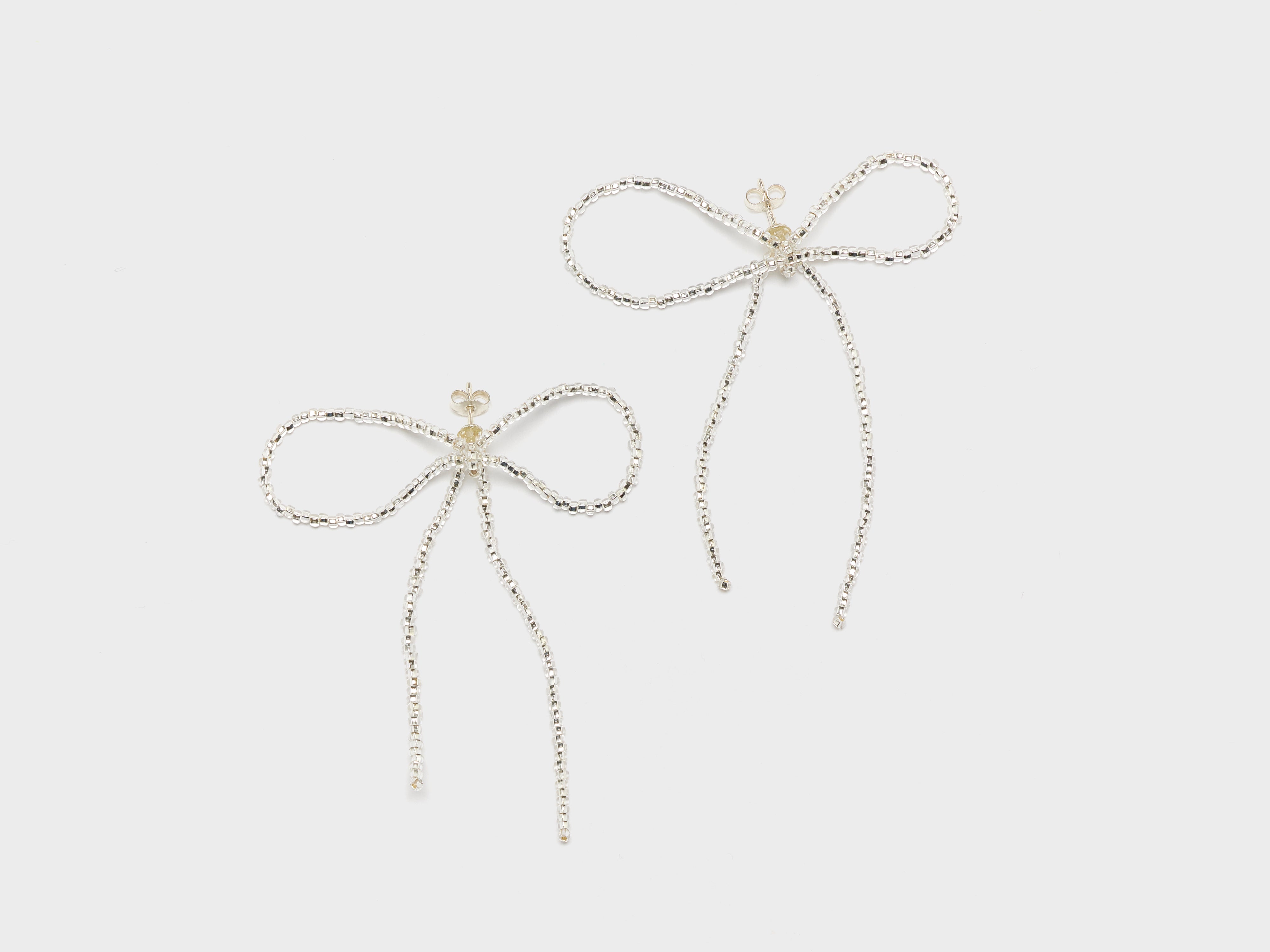 Sad Bow Ear Stick Earrings (252 / W / SILVER)